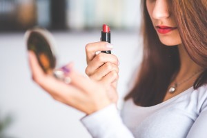 woman holding a lipstick